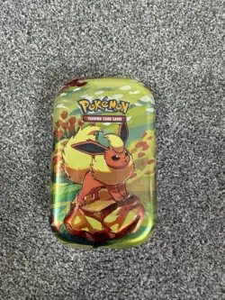 Pokemon Prismatic Evolutions - Sealed Mini Tin x1 Flareon - Image 1
